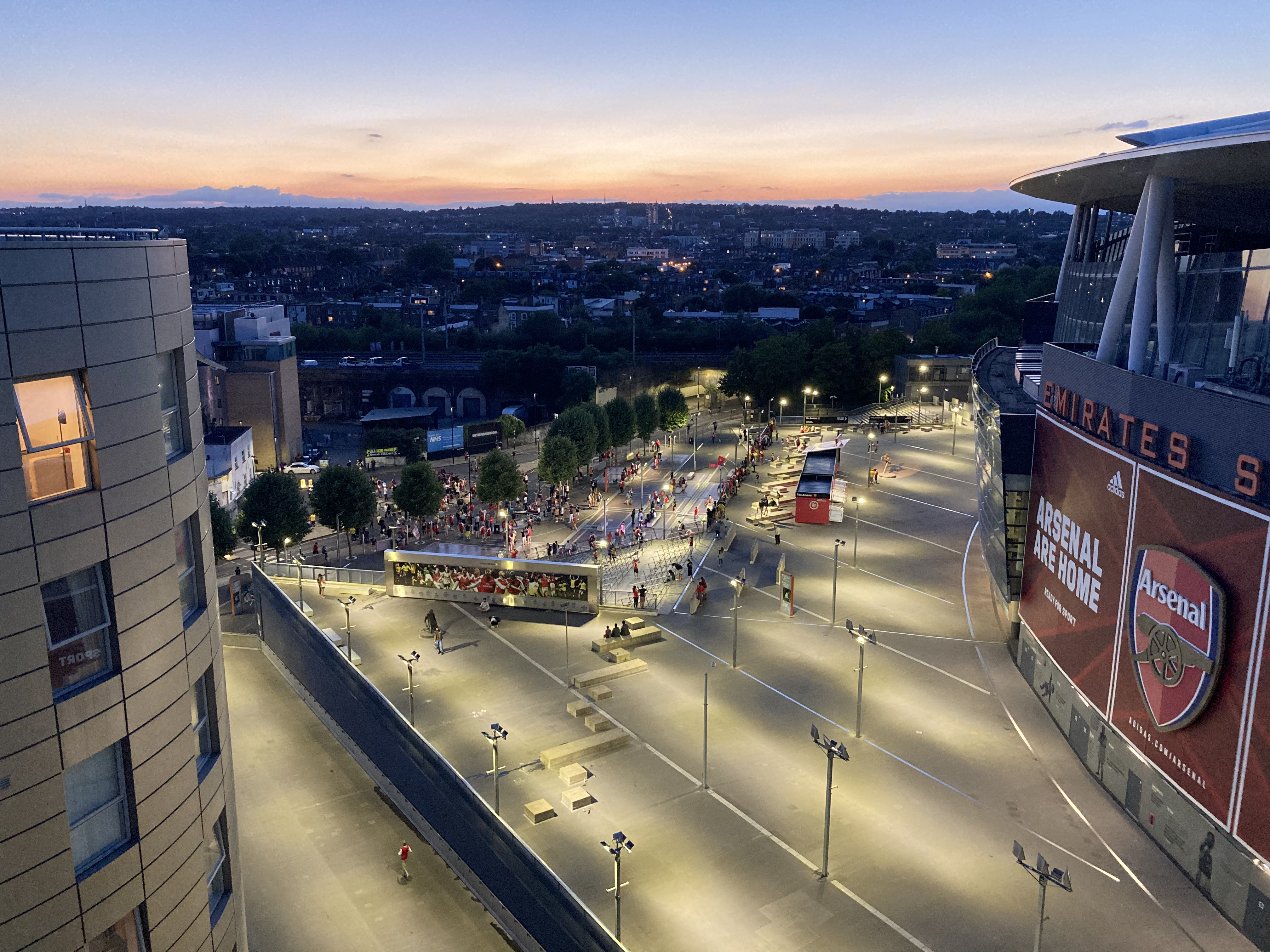 Arsenal Emirates Stadium and North London skyline at sunset
