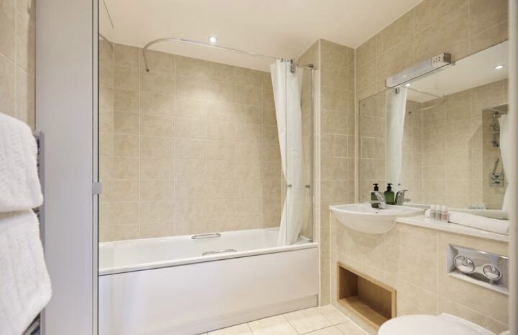 Bathroom with bath and shower